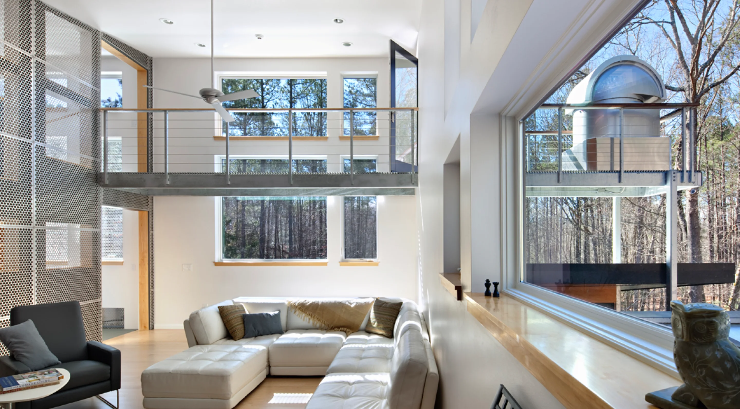 Photo of living room with arched ceilings and white walls